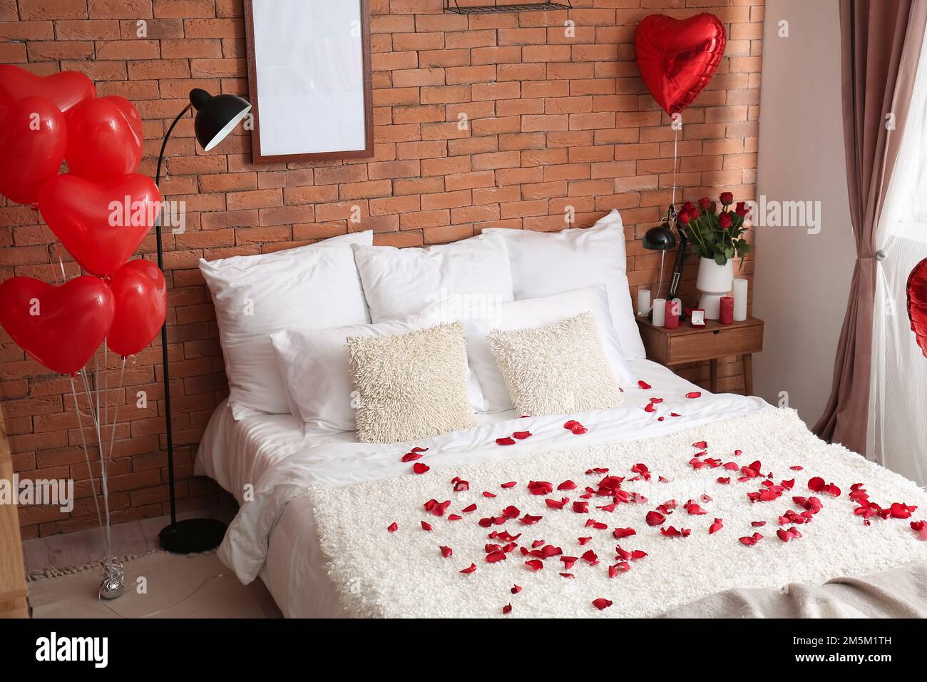 Interior of bedroom decorated for Valentine\'s Day with roses ...