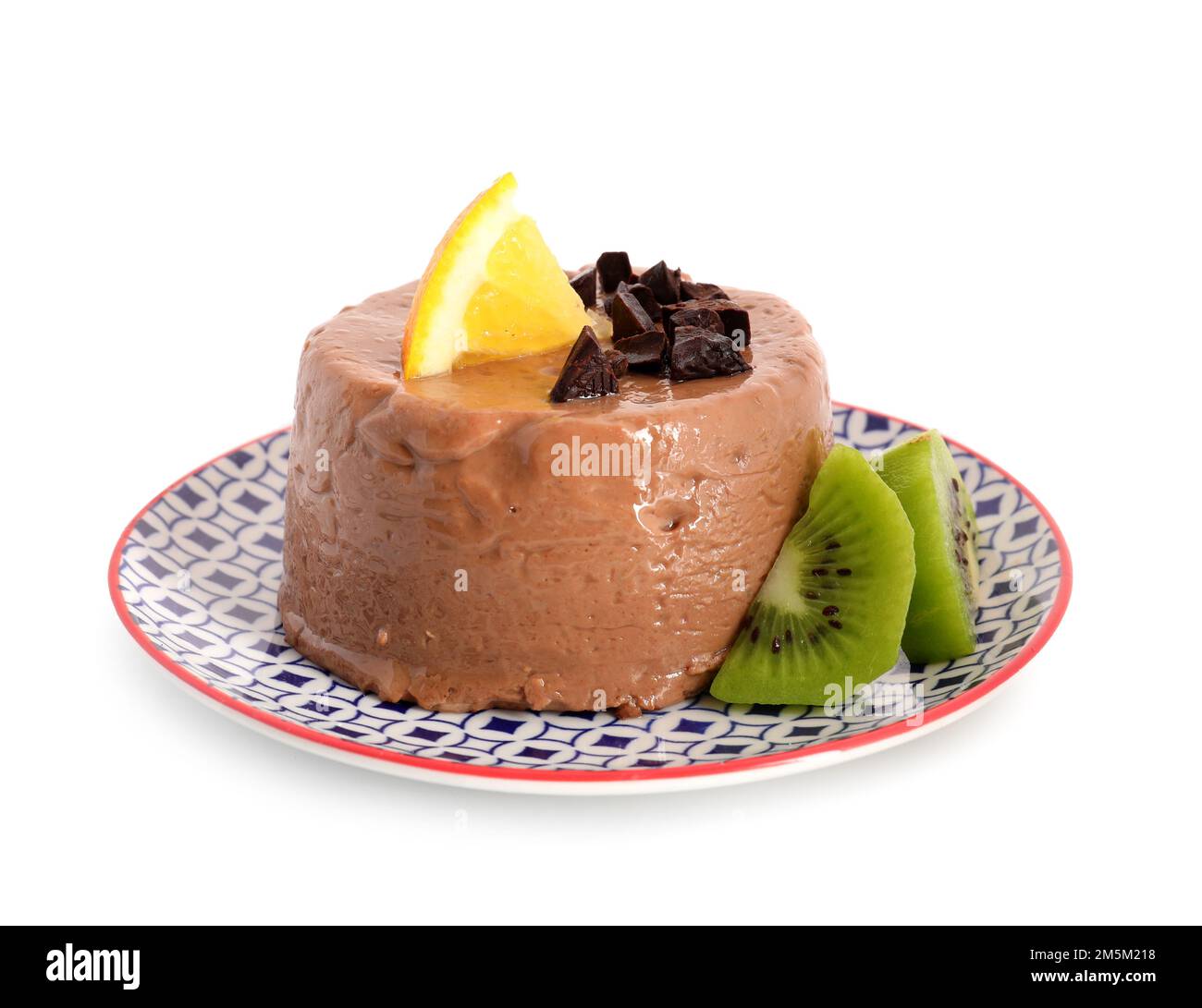 Delicious pudding with chocolate, lemon and kiwi slices on plate ...