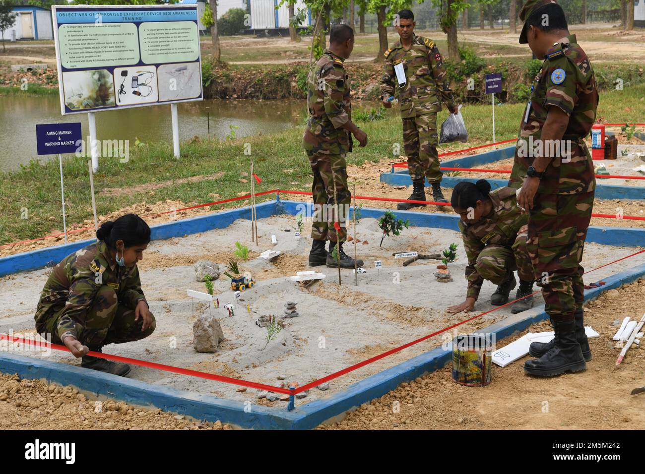 Bangladeshi soldiers construct scenario models in the cordoned off
