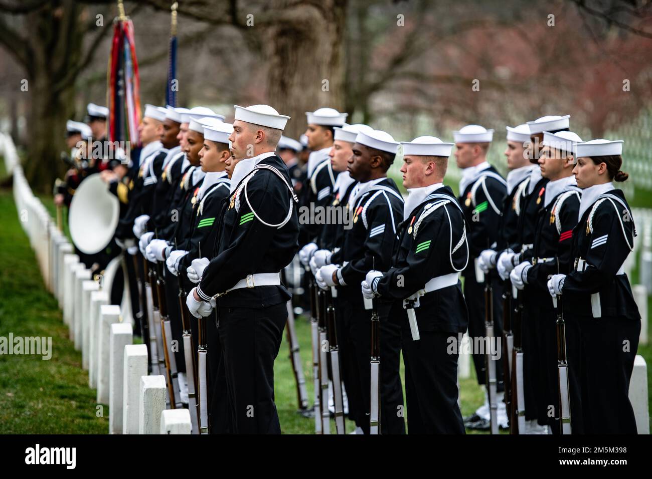 Sailors from the U.S. Navy Ceremonial Guard and the U.S. Navy Ceremonial Band support military funeral honors with funeral escort for U.S. Navy Seaman 1st Class Walter Stein in Section 36 of Arlington National Cemetery, Arlington, Va., March 24, 2022. Stein was killed during the attack on Pearl Harbor while serving aboard the USS Oklahoma.    From the Defense POW/MIA Accounting Agency (DPAA) press release:    On Dec. 7, 1941, Stein was assigned to the battleship USS Oklahoma, which was moored at Ford Island, Pearl Harbor, when the ship was attacked by Japanese aircraft. The USS Oklahoma sustai Stock Photo