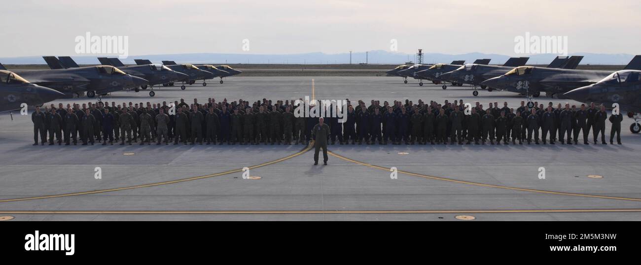 U.S. Marines with Marine Fighter Attack Training Squadron (VMFAT) 501 stand in formation for a squadron photo at Mountain Home Air Force Base, Idaho, March 24, 2022. VMFAT-501 deployed to Mountain Home Air Force Base to train entry-level pilots to be proficient at close-air support and high-explosive ordnance drops in preparation for their future-fleet F-35B units and aviation operations abroad. VMFAT-501 is a subordinate unit of 2nd Marine Aircraft Wing, the aviation combat element of II Marine Expeditionary Force. Stock Photo