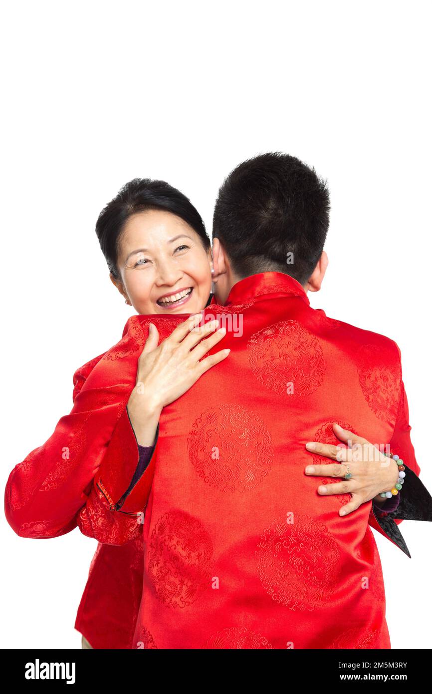 Chinese New Year tang suit man hug mother Stock Photo Alamy