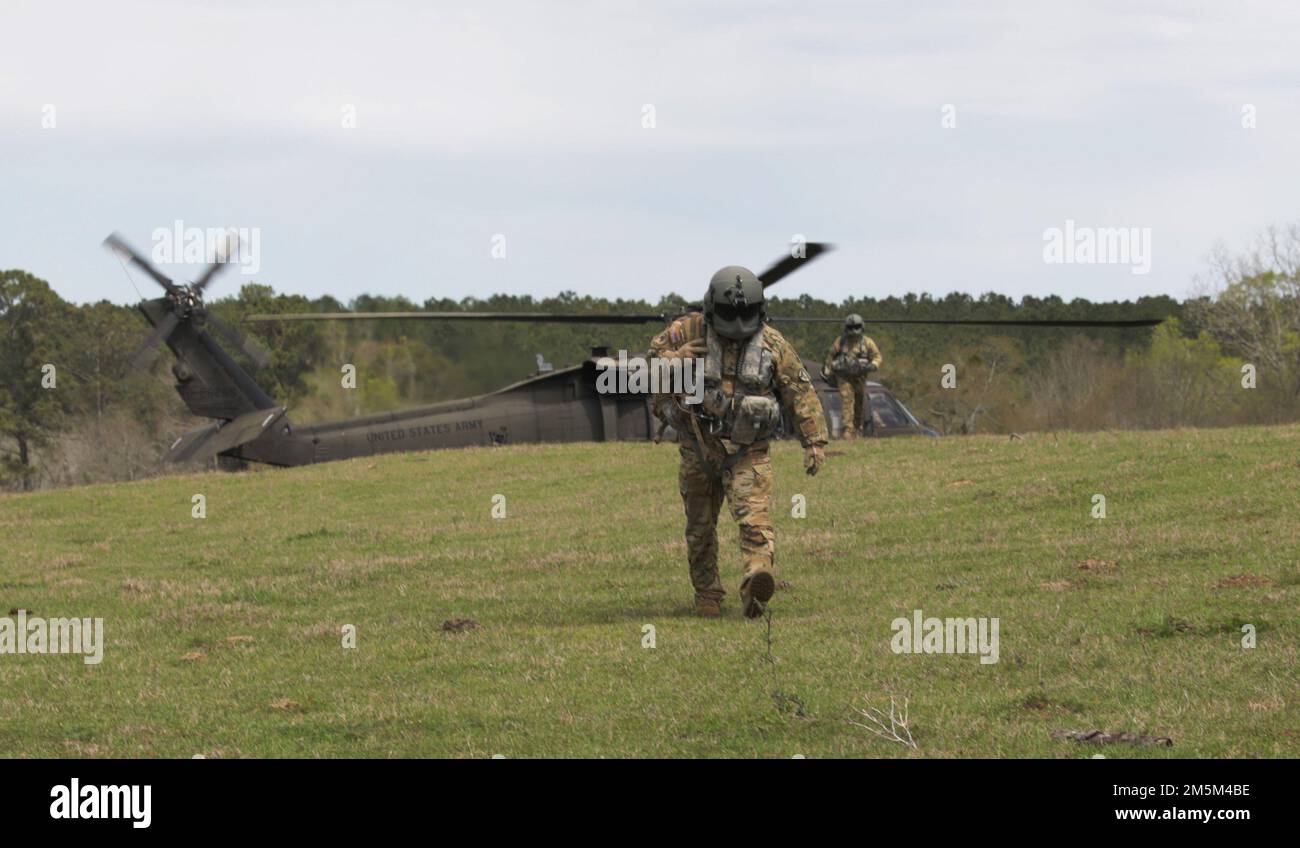Medical personnel from FlatIron exit the UH60L Blackhawk to begin