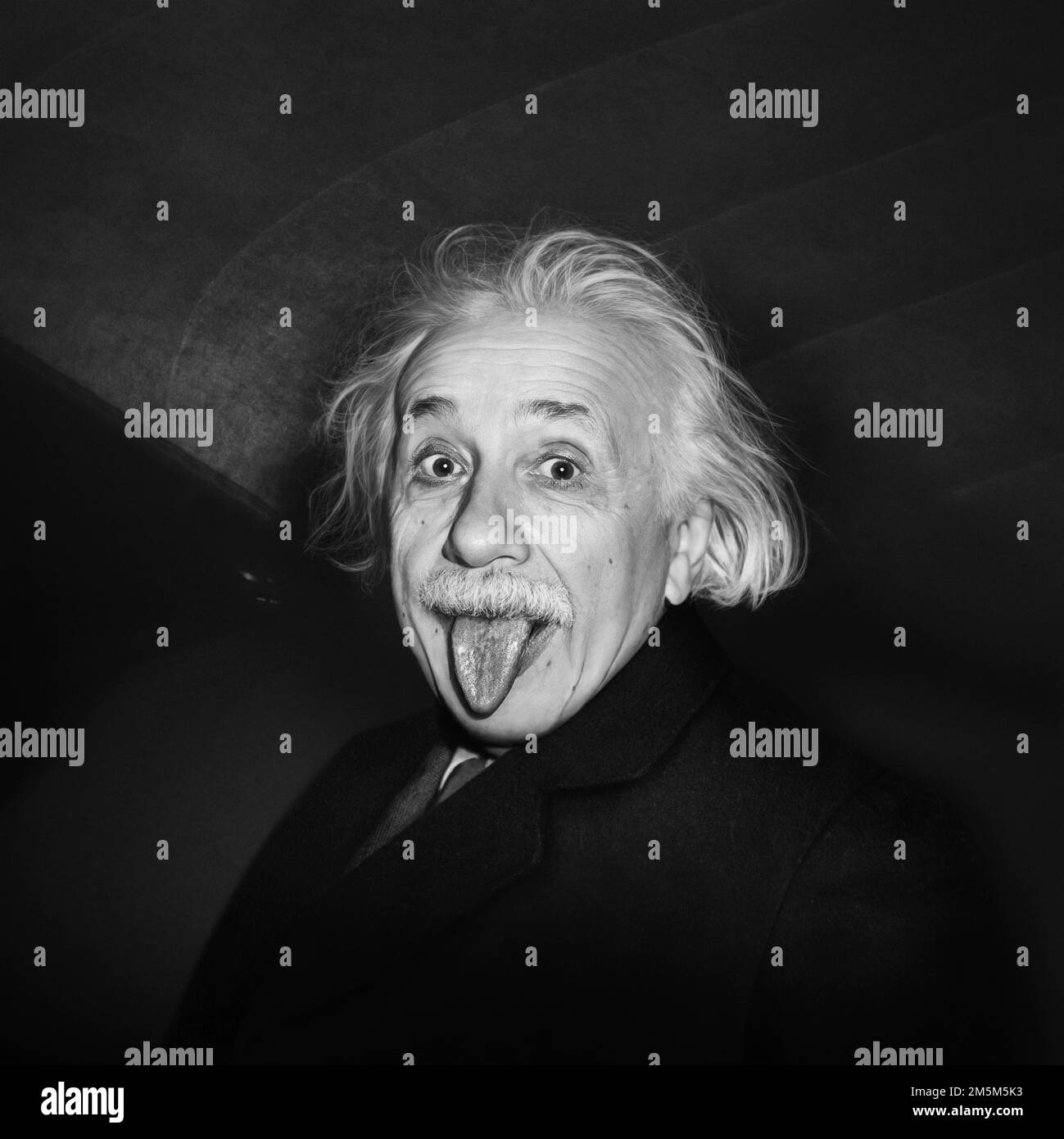 Iconic humorous photograph of Albert Einstein on his birthday sticking