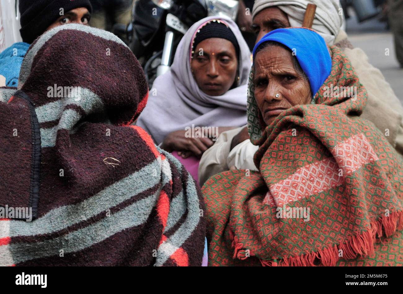 Women wearing shawls and blankets in the cold winter of Kolkata, India