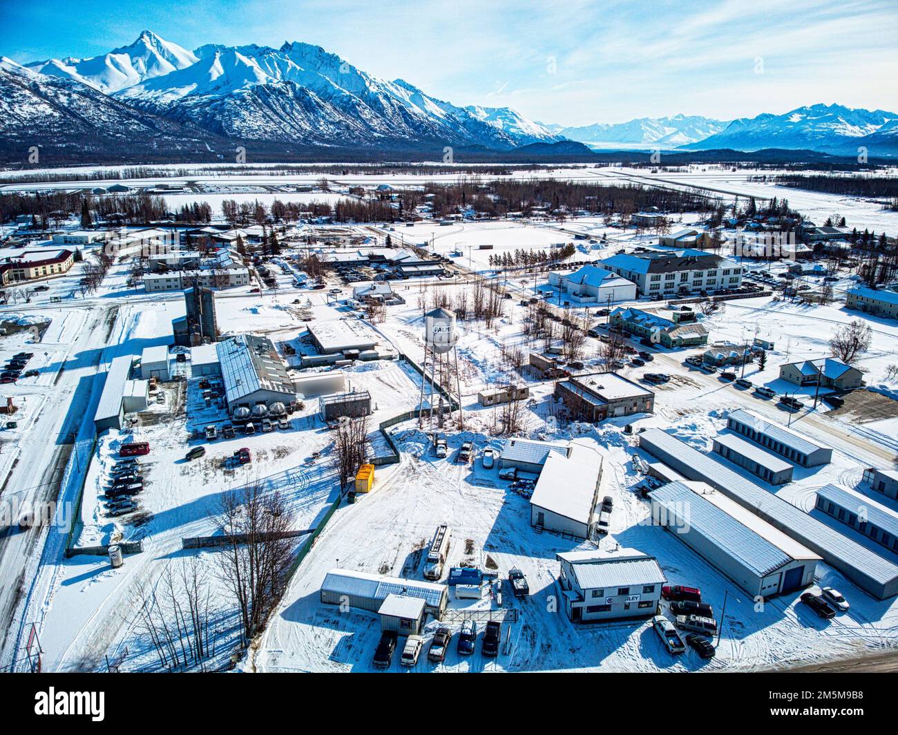 An aerial shot of industrial buildings and cars parked nearby in the city of Palmer, Alaska Stock Photo