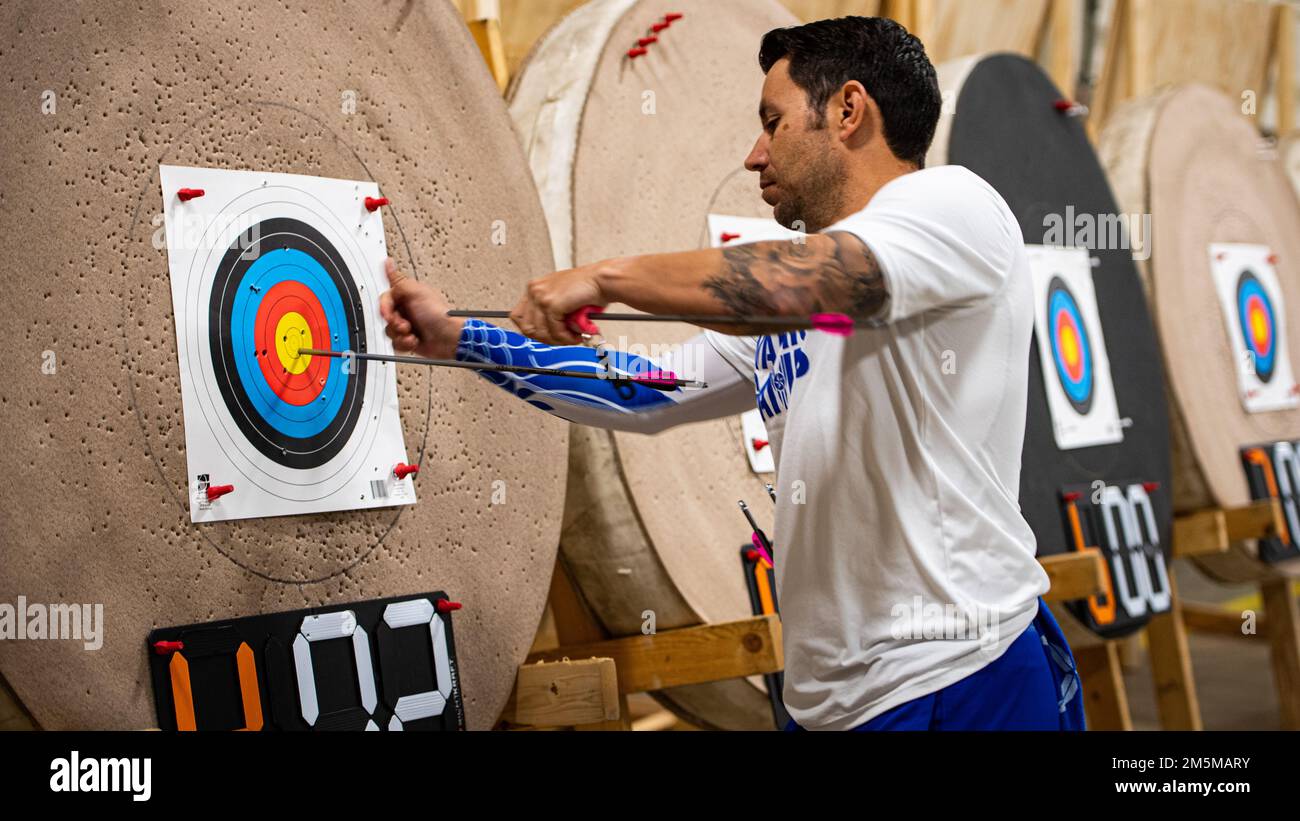 U.S. Air Force Master Sgt. Kenneth Guinn, an Air Force Wounded Warrior athlete, retrieves and arrow during an archery competition at Joint Base San Antonio-Randolph on March 25, 2022. More than 60 wounded, ill or injured service men and women from around the world compete in the first in-person trials since 2019 for a spot on the 2022 U.S. Air Force Wounded Warrior team, which will represent the Air Force at adaptive sports competitions throughout the year. Stock Photo