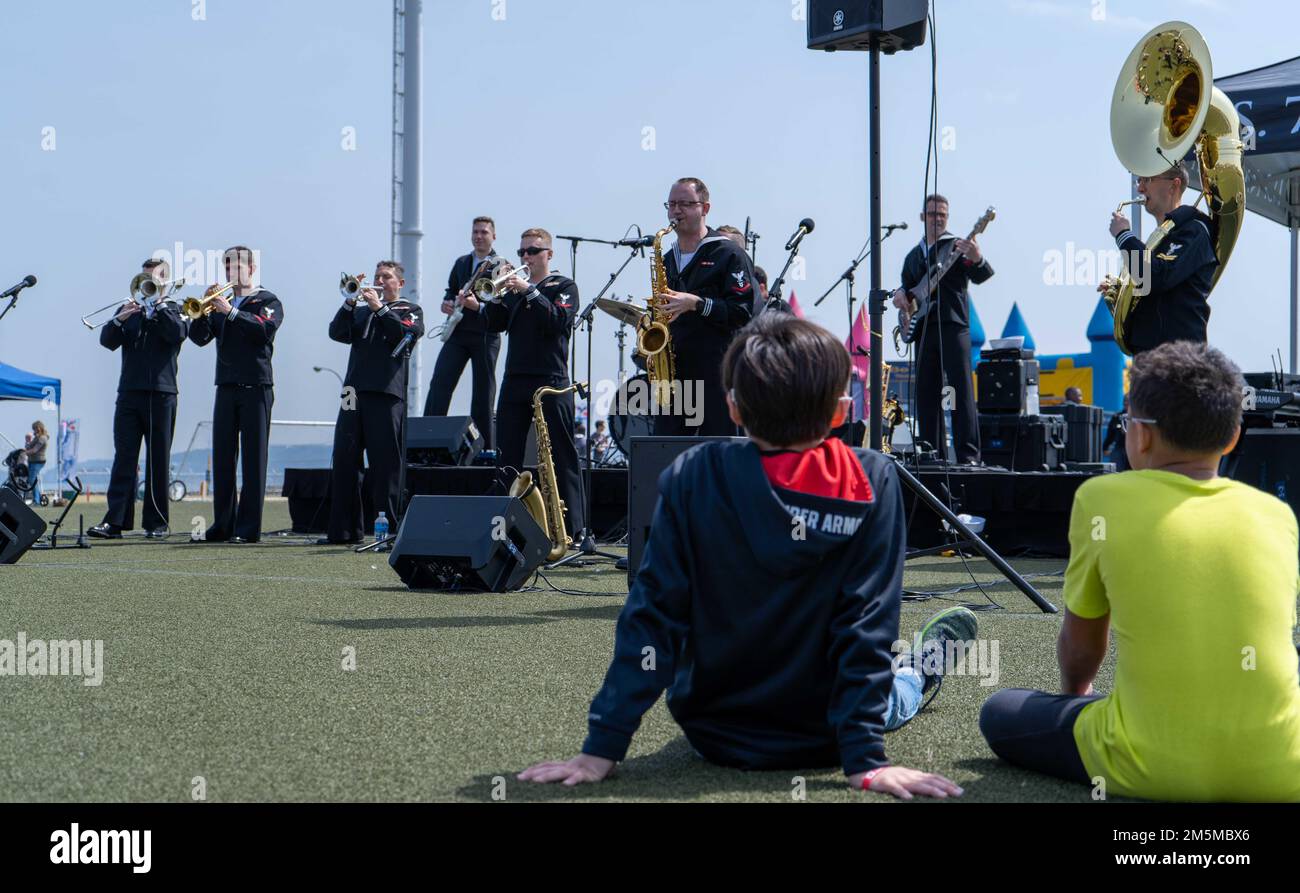 220325-N-RC359-1100 YOKOSUKA, Japan (March 25, 2022) Sailors assigned to the U.S. Navy 7th Fleet Band perform at the USS Ronald Reagan command picnic at Purdy Field onboard Commander, Fleet Activities Yokosuka. Ronald Reagan, the flagship of Carrier Strike Group 5, provides a combat-ready force that protects and defends the United States, and supports alliances, partnerships and collective maritime interests in the Indo-Pacific region. Stock Photo