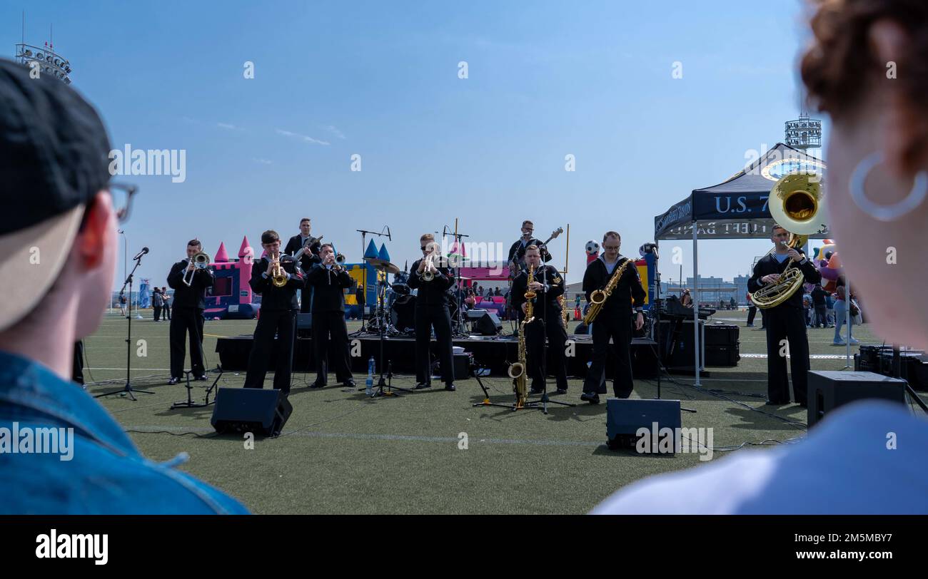 220325-N-RC359-1096 YOKOSUKA, Japan (March 25, 2022) Sailors assigned to the U.S. Navy 7th Fleet Band perform at the USS Ronald Reagan command picnic at Purdy Field onboard Commander, Fleet Activities Yokosuka. Ronald Reagan, the flagship of Carrier Strike Group 5, provides a combat-ready force that protects and defends the United States, and supports alliances, partnerships and collective maritime interests in the Indo-Pacific region. Stock Photo