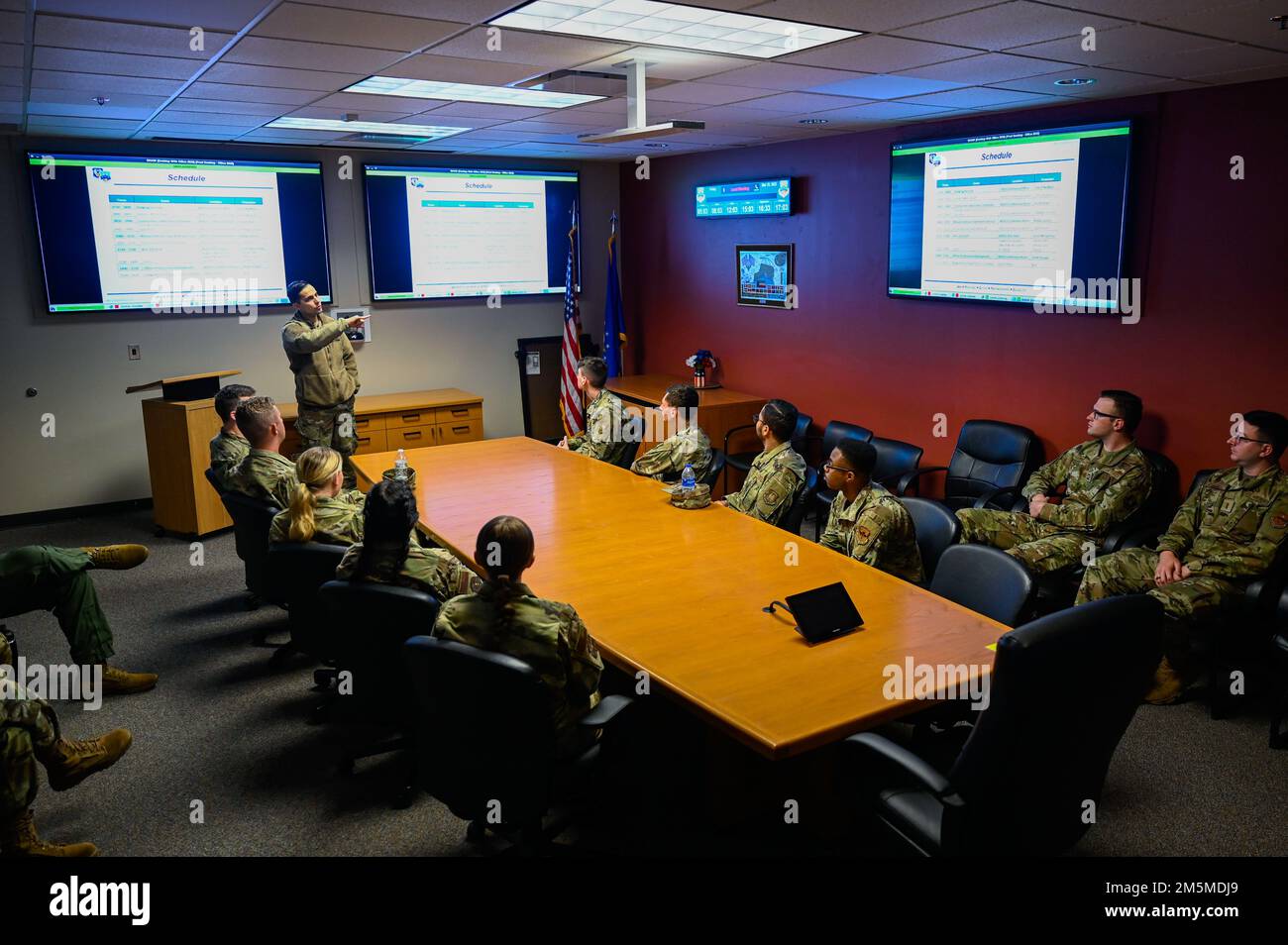 U.S. Air Force 1st Lt. Alexander Nicklaus, 609th Air Communications Squadron Weapons Systems Operations officer in charge, briefs cadets from Air Force Reserve Officer Training Corps Detachment 775 during an immersion tour at Shaw Air Force Base, South Carolina, March 25, 2022. The cadets were briefed on the various mission sets of the 609th ACOMS, including their role in premier communications and cyber security for Ninth Air Force (Air Forces Central) assets. Stock Photo
