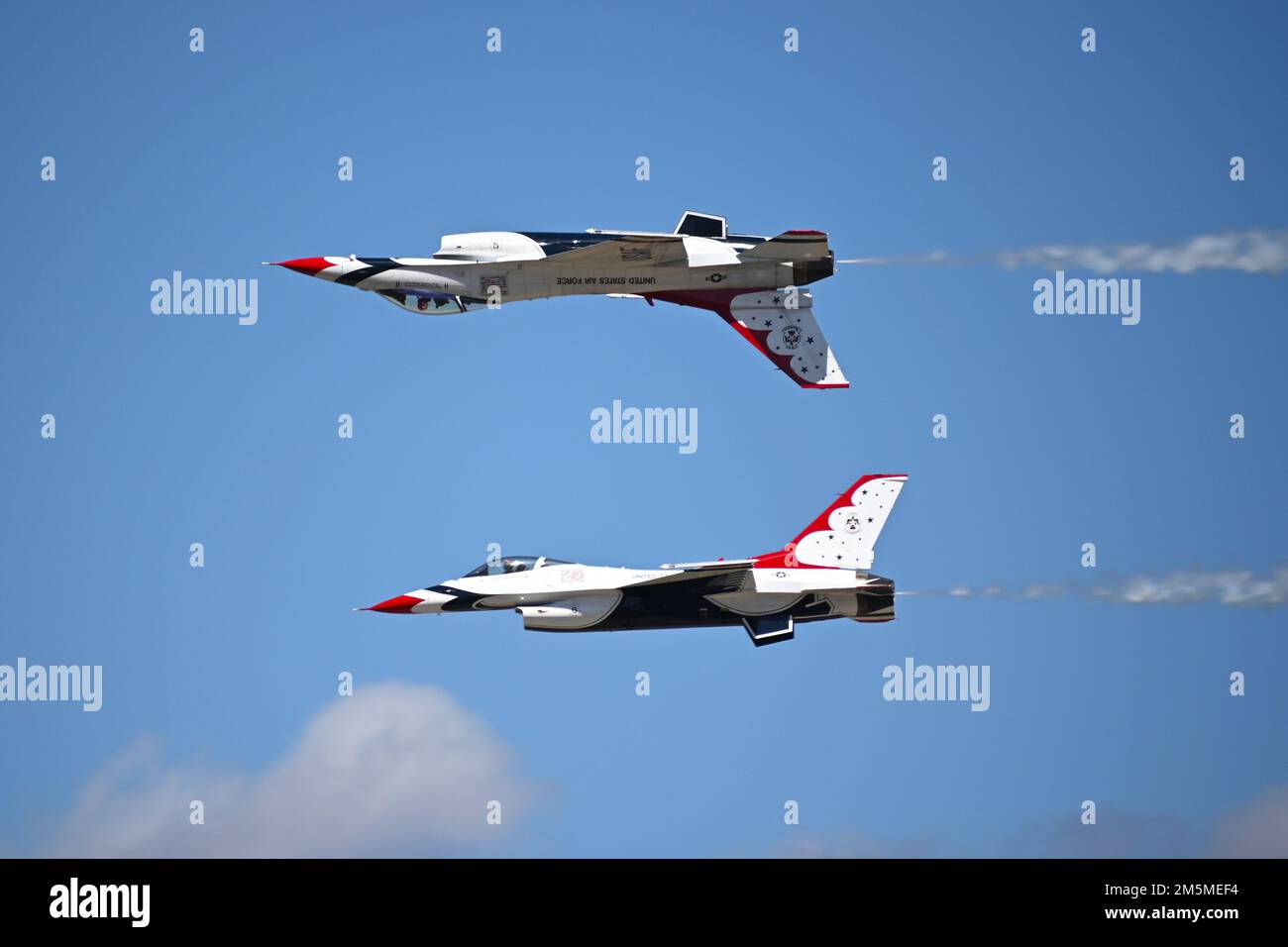Two USAF Thunderbirds perform an aerial maneuver during the Wings Over