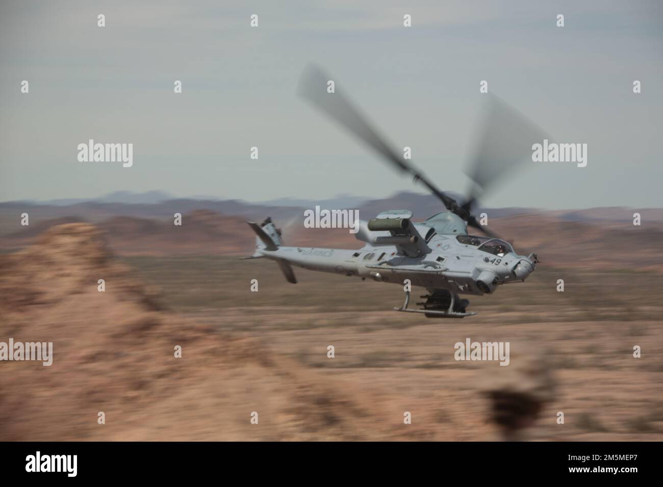 A U.S. Marine Corps AH-1Z Viper assigned to Marine Aviation Weapons and Tactics Squadron One (MAWTS-1), conducts close air support during Weapons and Tactics Instructor (WTI) course 2-22, near Chocolate Mountain Gunnery Range, California, March 25, 2022. WTI is a seven-week training event hosted by MAWTS-1, providing standardized advanced tactical training and certification of unit instructor qualifications to support Marine aviation training and readiness, and assists in developing and employing aviation weapons and tactics. Stock Photo