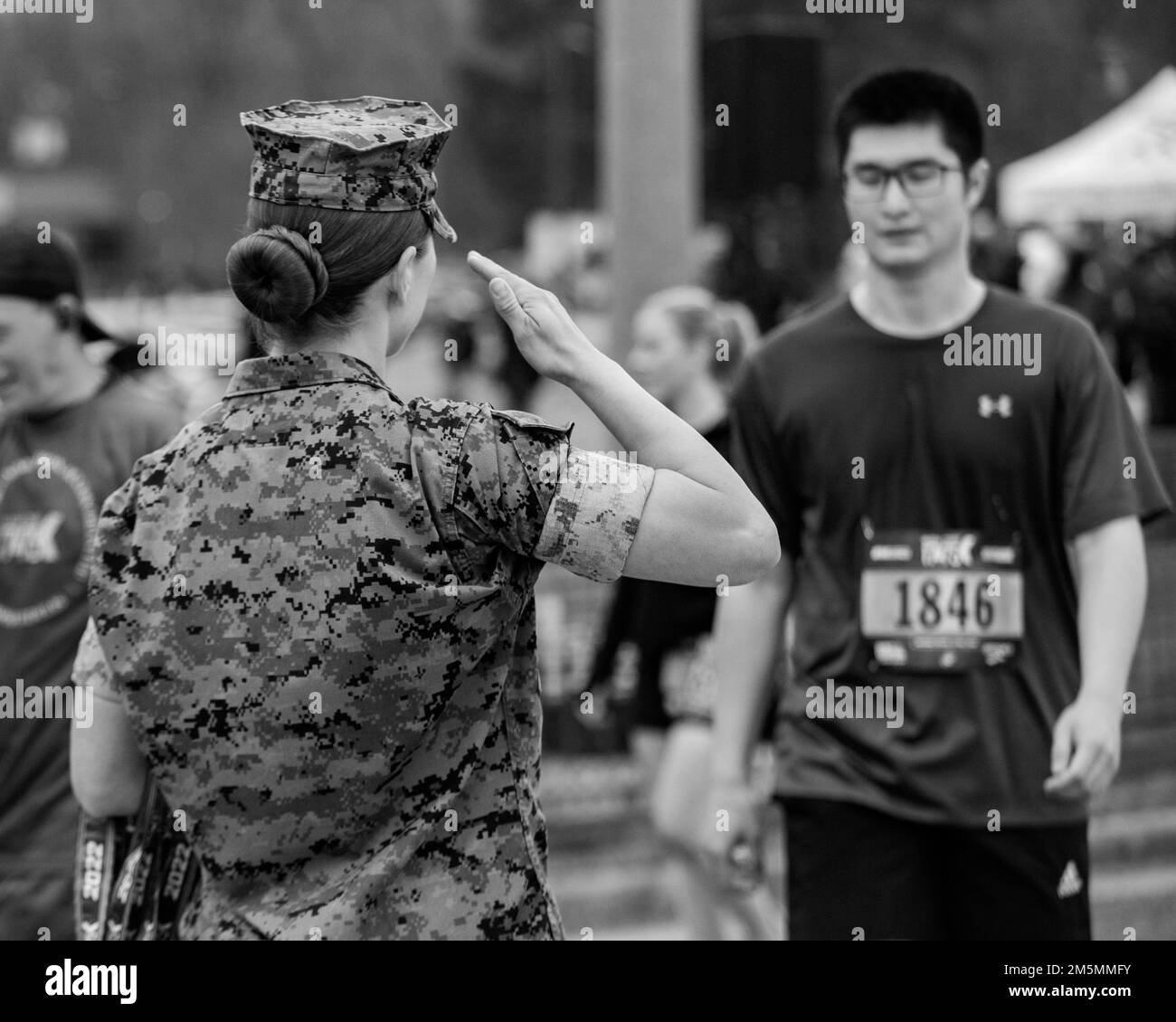 Participants of the Marine Corps Marathon 17.75k receive medals in