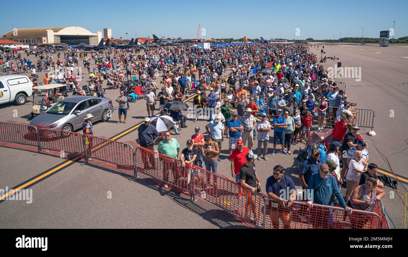 Members of the local community watch an aerial performance during Tampa