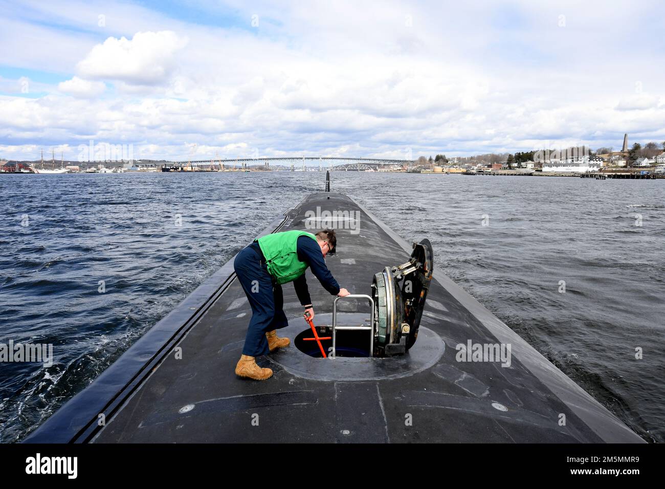 220326-N-GR655-0155 GROTON, Connecticut (March 26, 2022) – Petty Officer 1st Class Nathan Matzenbacher, a sonar technician attached to the Virginia-class submarine USS Delaware (SSN 791), conducts underway preparations as the ship transits the Thames River March 26, 2022. Delaware’s 132-man crew transited to Wilmington, Delaware to participate in week-long commemoration events in honor of the boat’s commissioning ceremony that took place administratively April 2020 due to COVID restrictions at the time. Delaware, the seventh U.S Navy ship and first submarine named after the first U.S. state of Stock Photo