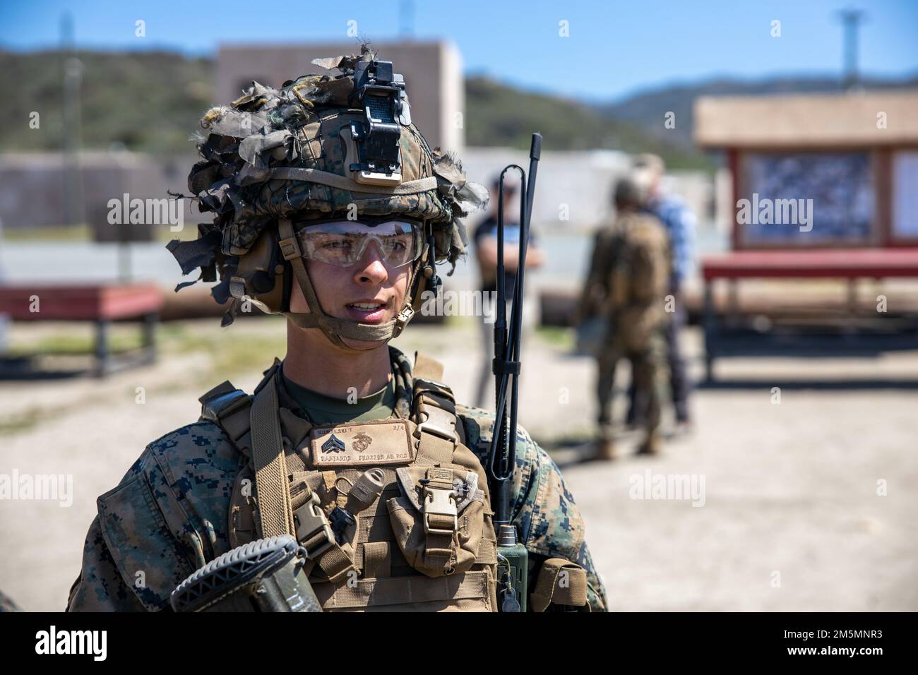 U.S. Marine Corps Cpl. Tyler Kowalski, a rifleman with Fox Company, 2nd Battalion, 4th Marines, 1st Marine Division prepares for a patrol in the Infantry Immersion Trainer during a I Marine Expeditionary Force Information Group Marine Corps Combat Readiness Evaluation exercise at Marine Corps Base Camp Pendleton, California, March 26, 2022. The purpose of the MCCRE is to formally evaluate the unit's core and/or assigned mission essential tasks in order to ensure service standardization and combat readiness. Stock Photo