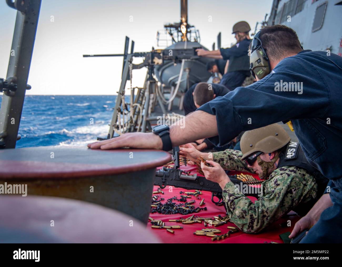 220326-N-FS190-1103 ATLANTIC OCEAN (March 26, 2022 Sailors assigned to the Arleigh Burke-class guided-missile destroyer USS Truxtun (DDG 103) qualify to man the M240B and .50 caliber machine guns during a crew-served weapons shoot onboard the for Task Force Exercise (TFEX), Mar. 26, 2022. TFEX is a scenario driven exercise that serves as certification for independent deploying ships and is designated to test mission readiness and performance in integrated operations. Truxtun is underway for Carrier Strike Group (CSG) 4 training evolutions. Stock Photo