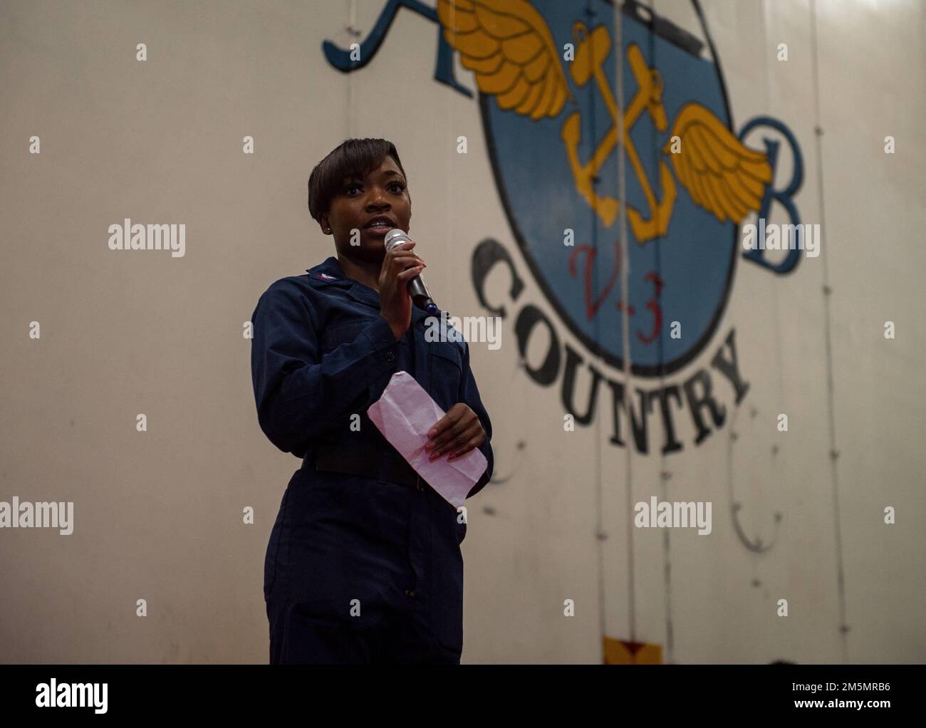 220327-N-PG226-1012 IONIAN SEA (Mar. 27, 2022) Logistics Specialist 2nd Class Autumn Cole, from Jacksonville, Florida, speaks during a women's history month observance in the hangar bay of the Nimitz-class aircraft carrier USS Harry S. Truman (CVN 75), Mar. 27, 2022. The Harry S. Truman Carrier Strike Group is on a scheduled deployment in the U.S. Sixth Fleet area of operations in support of U.S., allied and partner interests in Europe and Africa. Stock Photo
