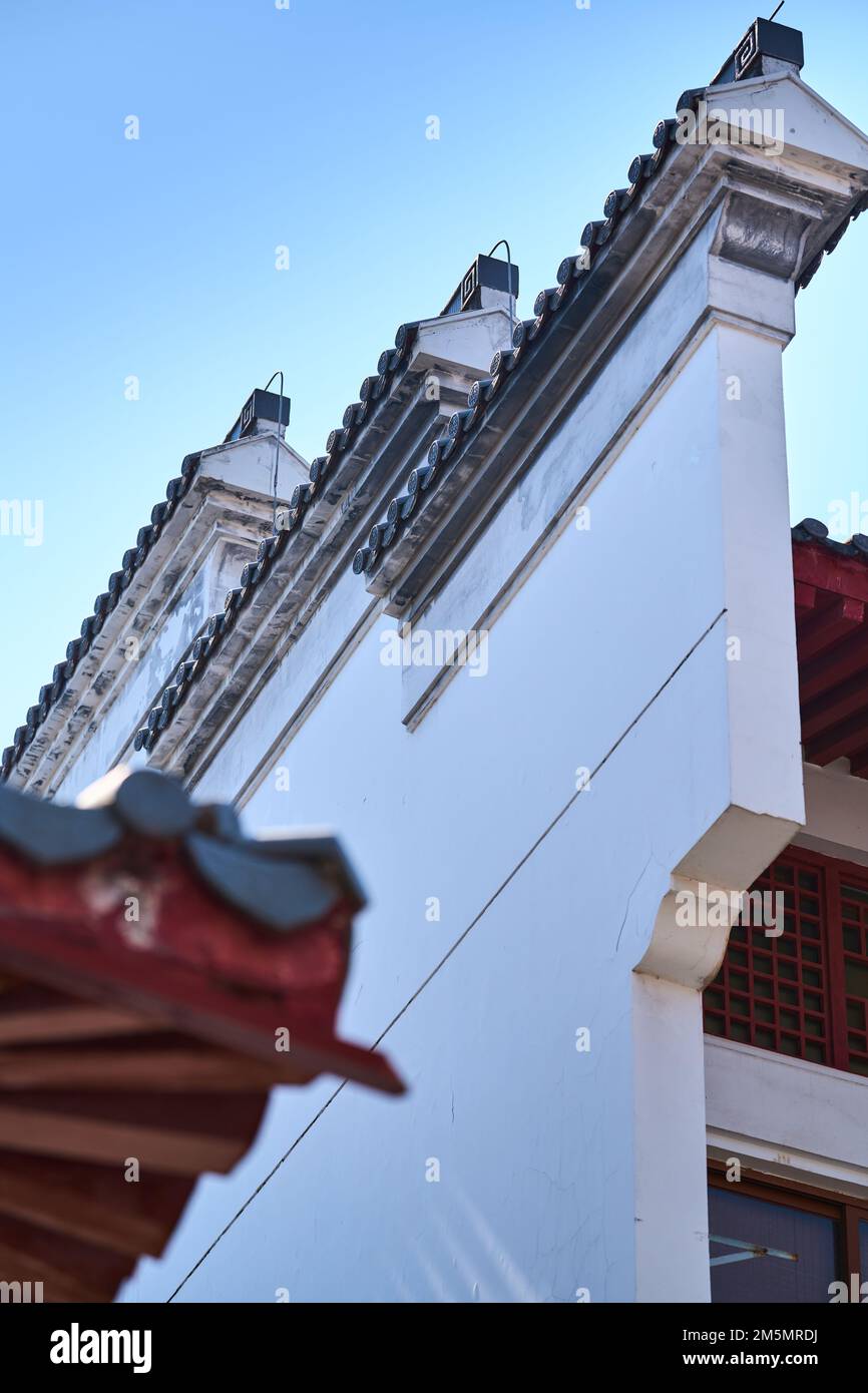 A low angle vertical shot exterior of Chinese architecture facade with ...