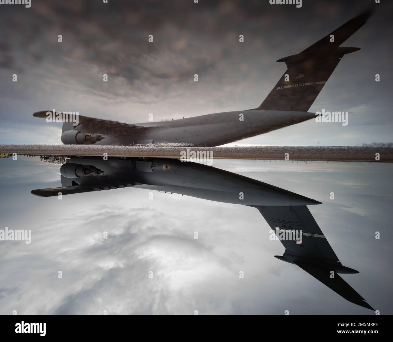 A Lockheed C-5M Super Galaxy, operated by the 22nd Airlift Squadron, Air Mobility Command, sits on the runway while being refueled during a movement of equipment at Royal Australian Air Force Base Darwin, NT, Australia, March 27, 2022. The C-5M will be moving U.S. Marine Corps equipment from Darwin to Okinawa, Japan, an initiative by Marine Rotational Force-Darwin 22, ensuring the equipment is operational to maintain a credible crisis and contingency-ready force that can contribute to a free and open Indo-Pacific region. Stock Photo