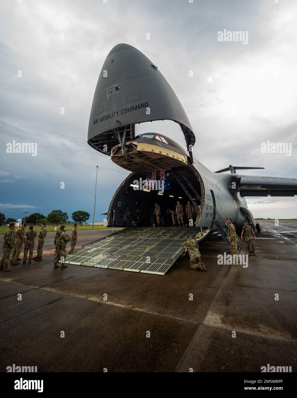 U.S. Airmen with the 22nd Airlift Squadron, Air Mobility Command, lower