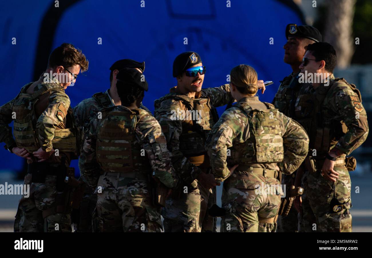 Airmen assigned to the 6th Security Forces Squadron meet before patrolling the flight line at MacDill Air Force Base, Florida, during the Tampa Bay AirFest March 27, 2022. More than 200,000 guests attended the air show during the two-day event. Stock Photo