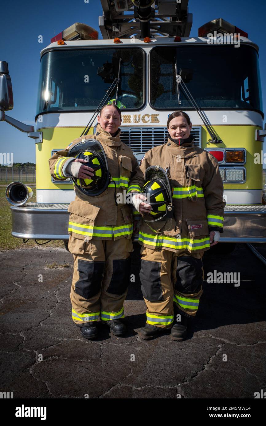 Master Sgt. Nicole Brannan (left), Department of Emergency Services senior enlisted leader with Fort Stewart-Hunter Army Airfield DES and Maj. Erin Peterson (right), operations officer with DES, suit up in firefighter equipment to cross train with the Hunter Army Airfield Fire Department. "Having a background in military police, cross training is essential as leaders because it helps us familiarize ourselves with what our firefighters do on a daily basis and what they might need to ensure mission success," Peterson said . Stock Photo