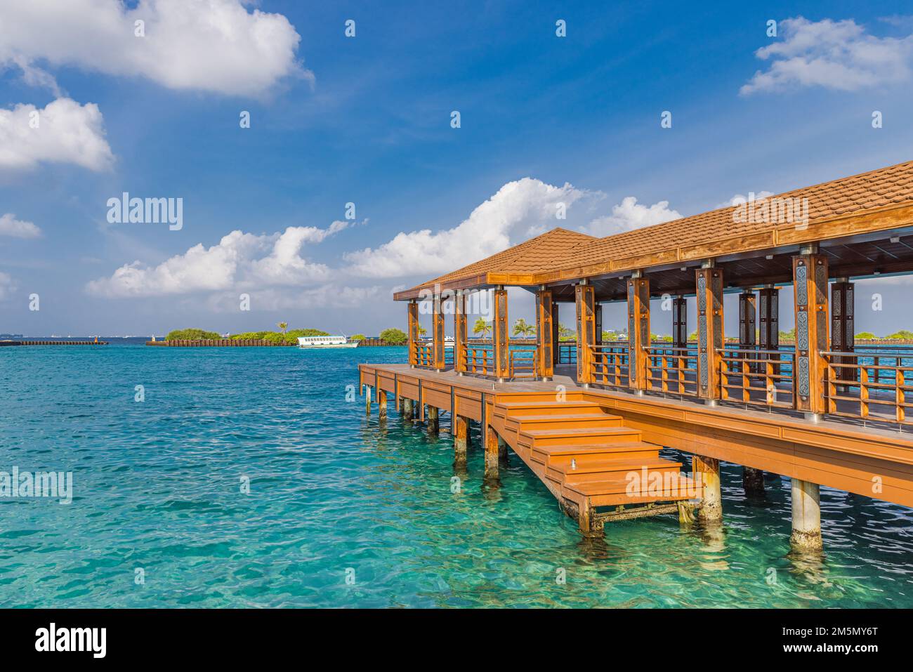 Maldives dock and airport area for tourists in a sunny day. Passenger boats in the Port near the Male International Airport, Maldives Stock Photo