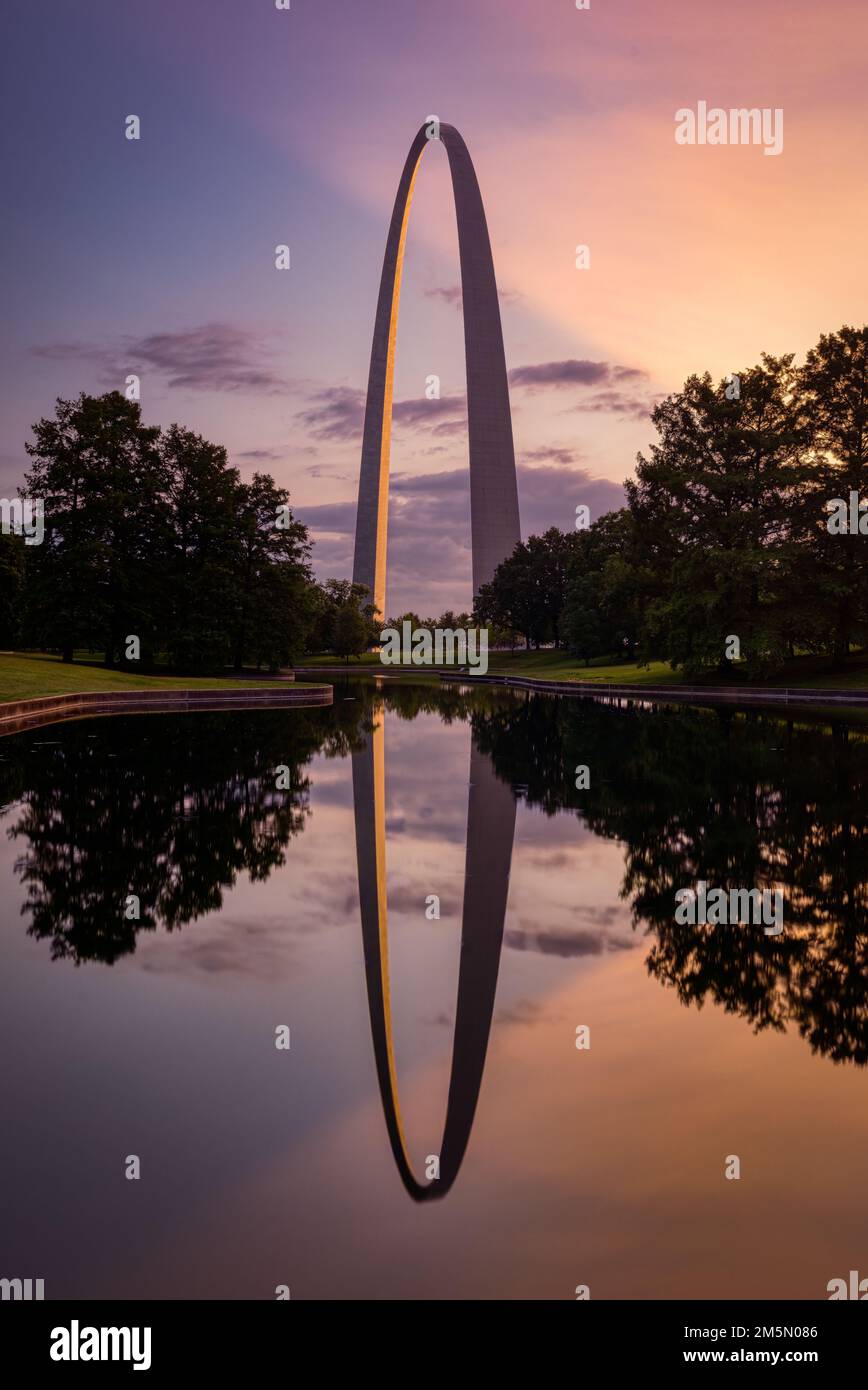 A beautiful view of St Louis gateway arch with a reflection on a pond ...