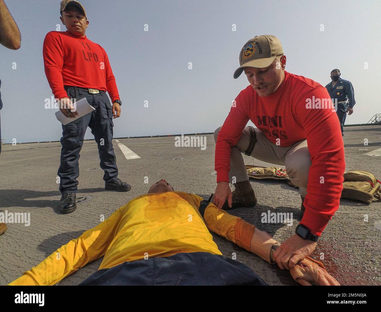 220328-N-TI693-1091    ATLANTIC OCEAN (March 28, 2022) - Lt. j.g. Kyler Smith, assistant operations officer, right, provides emergency care on a simulated injury during a mass casualty drill aboard the Expeditionary Sea Base USS Hershel 'Woody' Williams (ESB 4), March 28, 2022. Hershel 'Woody' Williams is on a scheduled deployment in the U.S. Sixth Fleet area of operations in support of U.S. national interests and security in Europe and Africa. Stock Photo