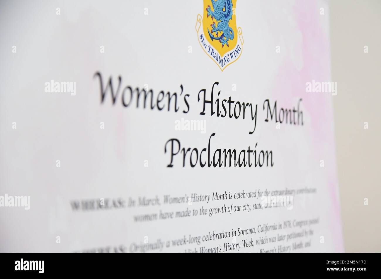 The Women's History Month Proclamation poster is displayed during the