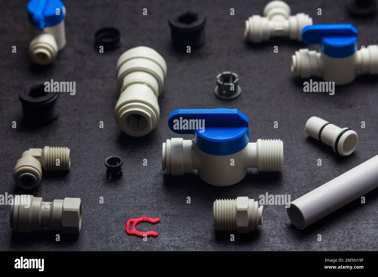 Detail of plastic plumbing, air product, pipe and tools. Valves, elbow