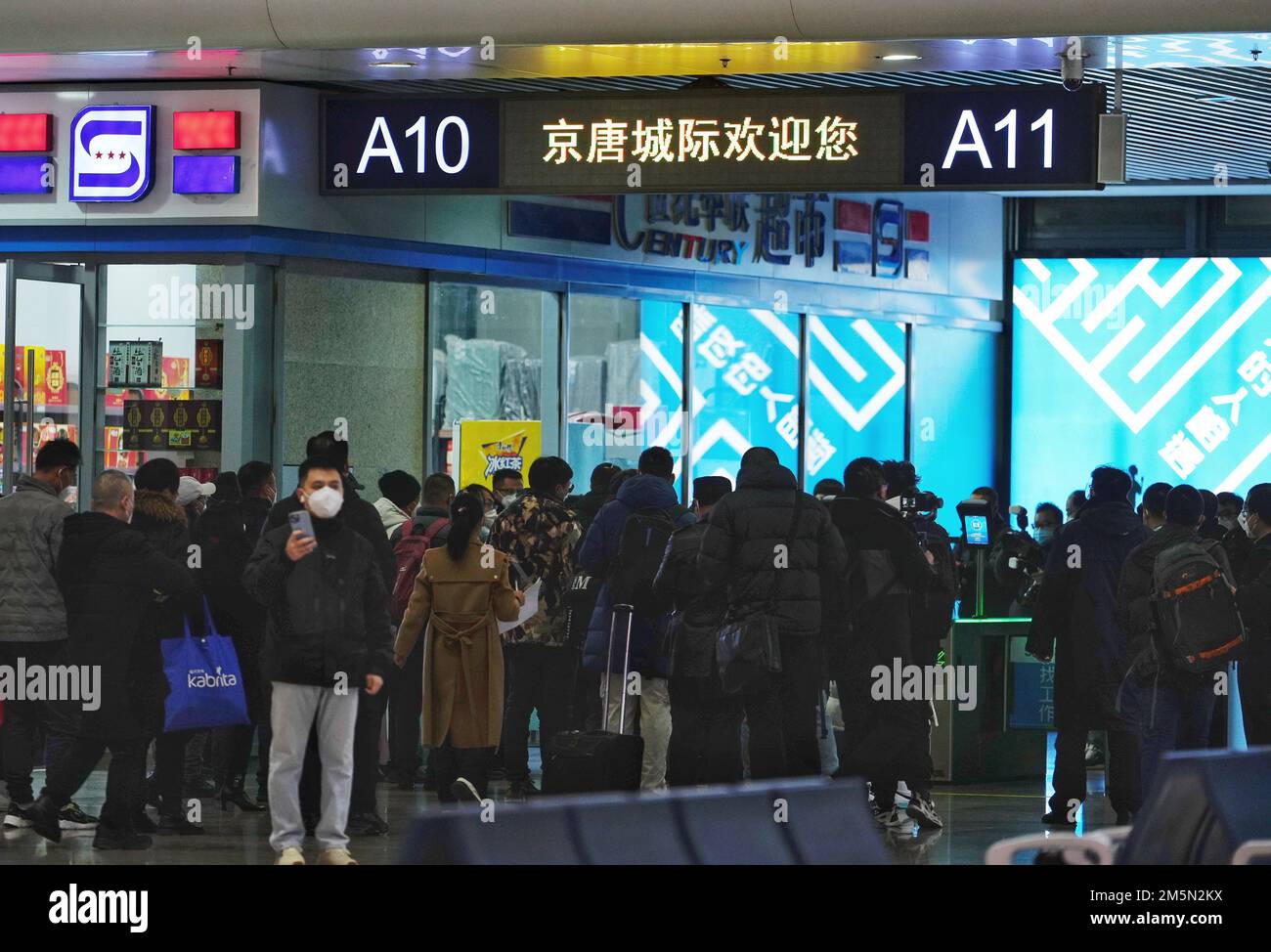 Tangshan, China's Hebei Province. 30th Dec, 2022. Passengers of the first train G8802 of the Beijing-Tangshan intercity railway have their tickets checked at Tangshan railway station in Tangshan, north China's Hebei Province, Dec. 30, 2022. The Beijing-Tangshan intercity railway started operation on Friday. With a designed speed of 350 km per hour, the 150-km railway links eight stations along the route. Credit: Zhao Liang/Xinhua/Alamy Live News Stock Photo