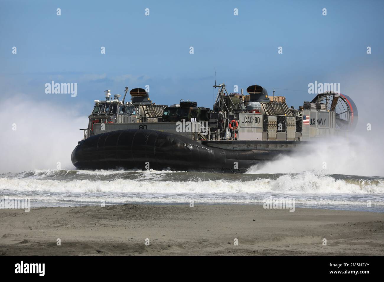 A Landing Craft Air Cushion 80 assigned to Naval Beach Unit 7 comes ...