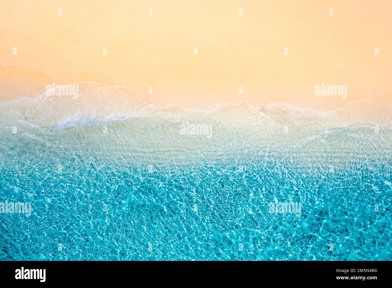 Summer seascape beautiful waves blue sea water in sunny day. Top view from drone. Sea aerial view, amazing tropical nature background. Beautiful coast Stock Photo