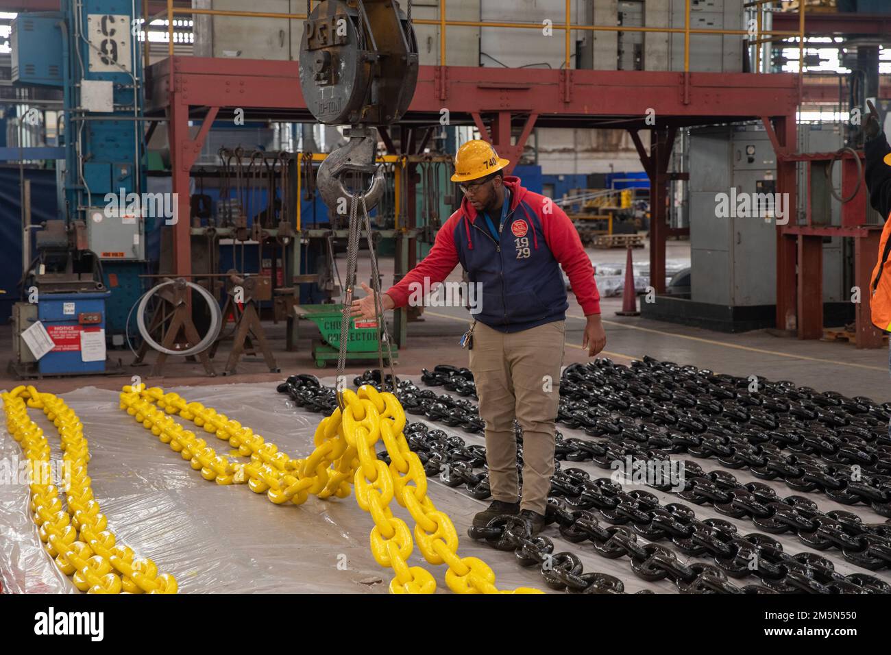 Shop 72 Riggers use cranes to lift anchor chains currently being worked