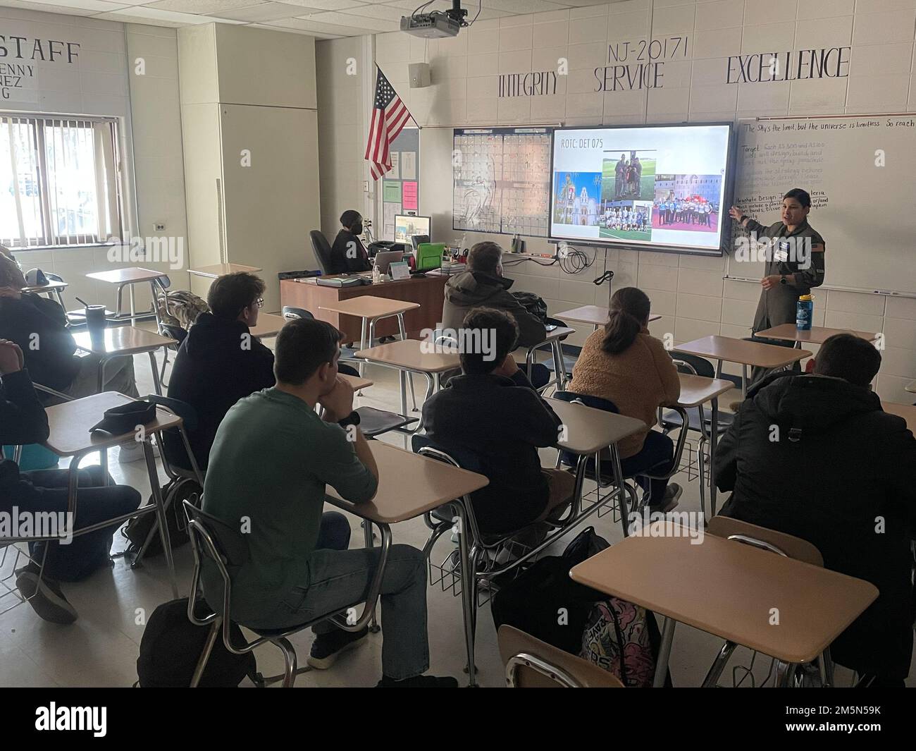 U.S. Air Force Capt. Irlanda Rodriguez from the 6th Airlift Squadron gives a presentation to level 300 and level 400 JROTC students on AIM High, North Burlington High school, New Jersey, Mar. 28, 2022. AIM Hight is an AFRS Detachment 1 mission geared towards informing, influencing, and inspiring tomorrow’s leaders through innovative outreach opportunities. Stock Photo