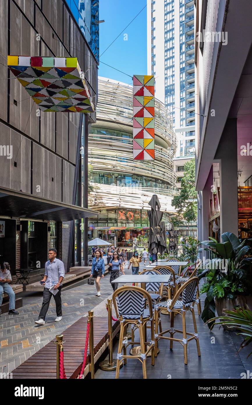 Shops and cafes in pedestrian walkway near The Exchange building near ...