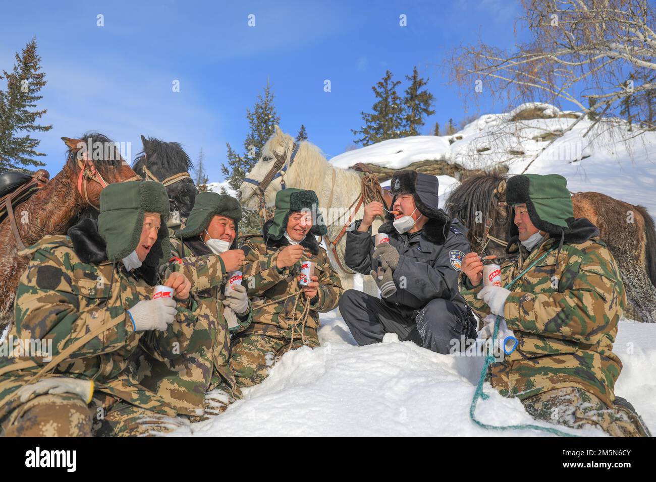 ALTAY, CHINA - DECEMBER 30, 2022 - Border police and border guards eat ...