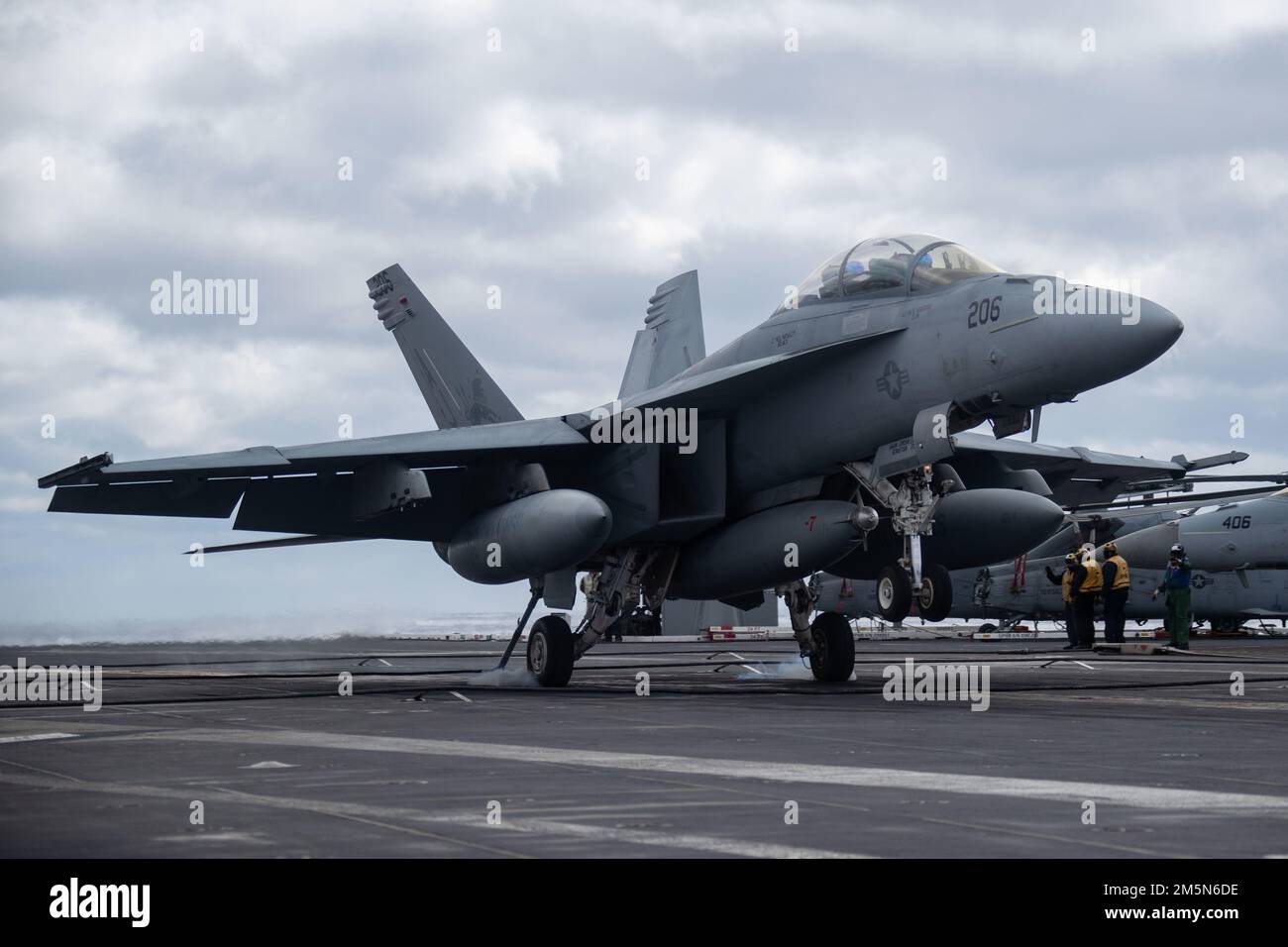 An F/A-18F Super Hornet, attached to the 'Blacklions' of Strike Fighter Squadron (VFA) 213, lands on USS Gerald R. Ford’s (CVN 78) flight deck, March 29, 2022. Ford is underway in the Atlantic Ocean conducting flight deck certification and air wing carrier qualification as part of the ship’s tailored basic phase prior to operational deployment. Stock Photo