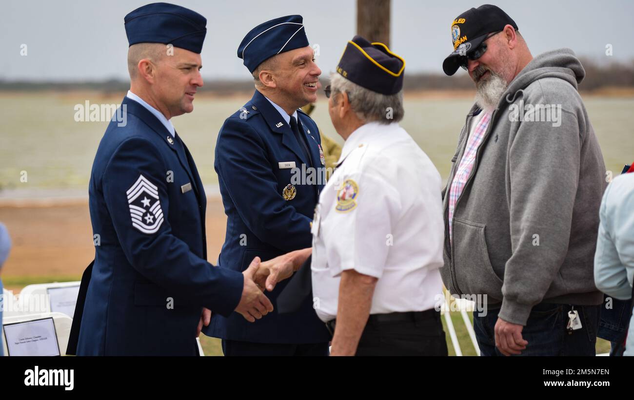 Chief Master Sgt. John P. Chilcote, left, 82nd Training Wing command chief master sergeant, and 82nd TRW Commander Brig. Gen. Lyle K. Drew talk to Vietnam veterans following the celebration of the new Vietnam Memorial unveiling at Lake Wichita Park in Wichita Falls, Texas, March 29, 2022. Sheppard AFB was a location where American POWs were repatriated and reunited with family during Operation Homecoming following in the Vietnam War. Drew was the keynote speaker at the event. Stock Photo