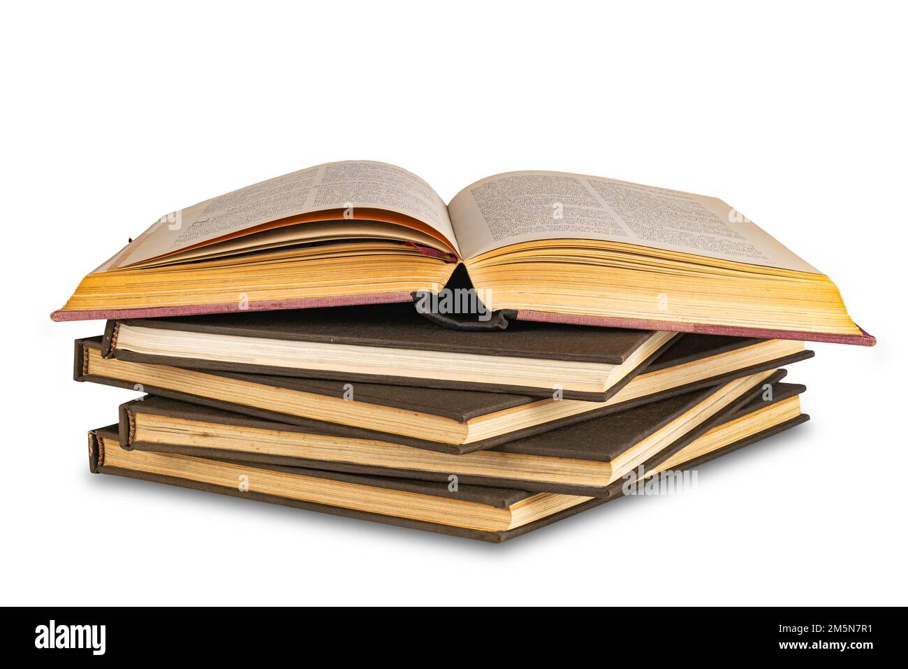 Isolated old books. Open book with empty pages, stack of old books and  inkwell isolated on white background with clipping path Stock Photo