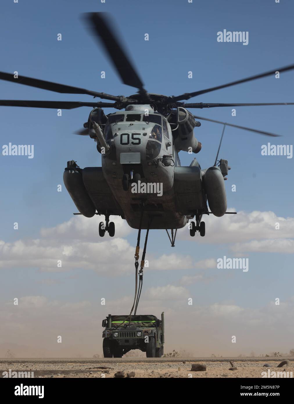 A U.S. Marine Corps CH-53E Super Stallion aircraft, assigned to Marine Aviation Weapons and Tactics Squadron One (MAWTS-1), conducts an external lift exercise during Weapons and Tactics Instructor (WTI) course 2-22, at Auxiliary Airfield II, near Yuma, Arizona, March 29, 2022. WTI is a seven-week training event hosted by MAWTS-1, providing standardized advanced tactical training and certification of unit instructor qualifications to support Marine aviation training and readiness, and assists in developing and employing aviation weapons and tactics. Stock Photo