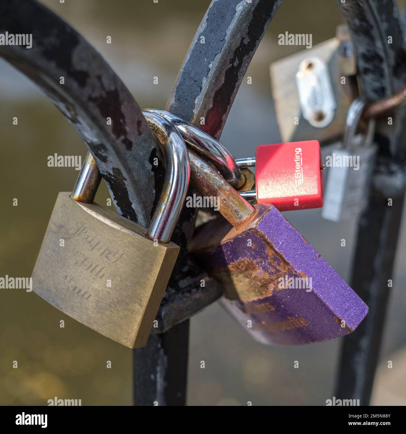 Detail of love locks on a black wrought iron fence at Camden Lock, Camden Town, London. Stock Photo