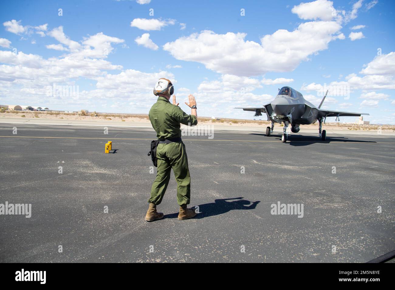 A U.S. Marine Corps F-35B Lightning II assigned to Marine Aviation Weapons and Tactics Squadron One (MAWTS-1), taxis prior to a ground refueling during Weapons and Tactics Instructor (WTI) course 2-22, at Laguna Army Airfield, Yuma, Arizona, March 29, 2022. WTI is a seven-week training event hosted by MAWTS-1, providing standardized advanced tactical training and certification of unit instructor qualifications to support Marine aviation training and readiness, and assists in developing and employing aviation weapons and tactics. Stock Photo