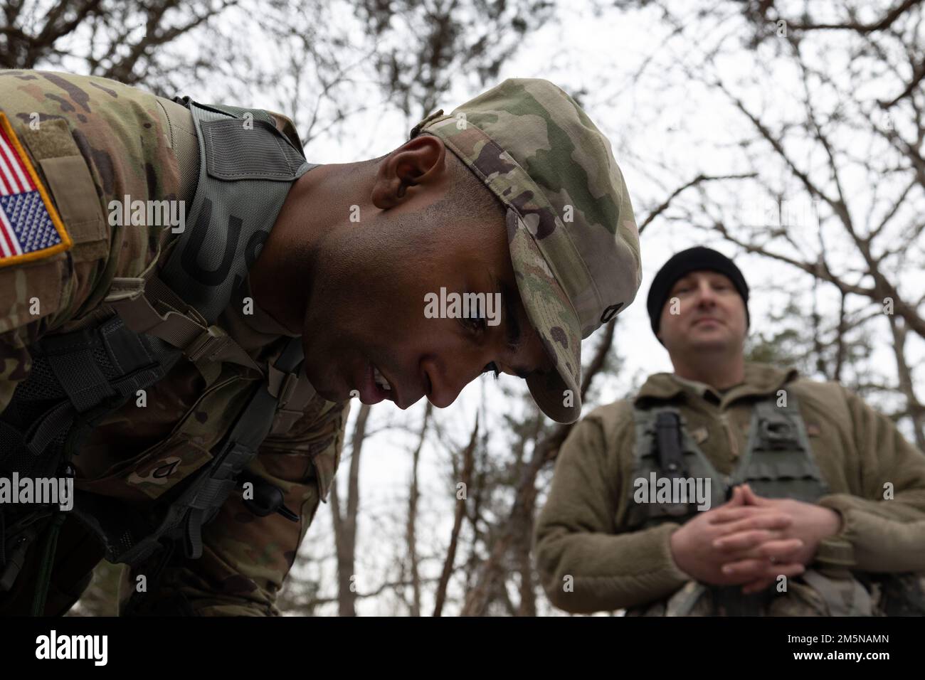 Pfc. Deandre Jones (left), human resource specialist, 1st Theater Sustainment Command, performs resection on a map during the Best Warrior Competition at Fort Knox, Kentucky, March 30, 2022. Jones was one of 35 soldiers competing in the Best Warrior Competition. Stock Photo