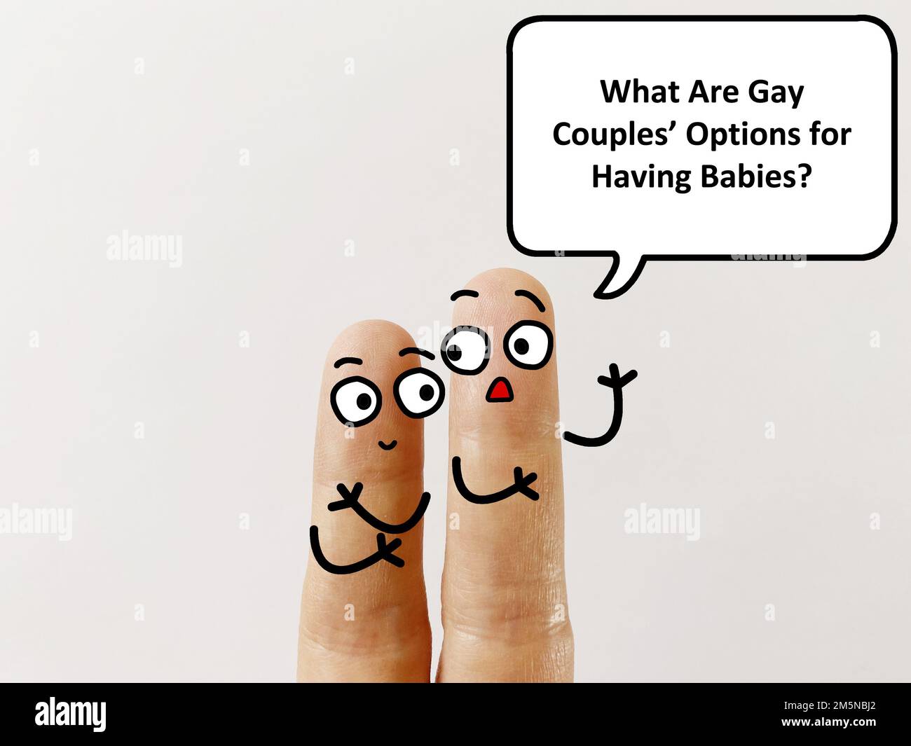 Two fingers are decorated as two person. One of them is asking what are gay couples' options for having babies. Stock Photo