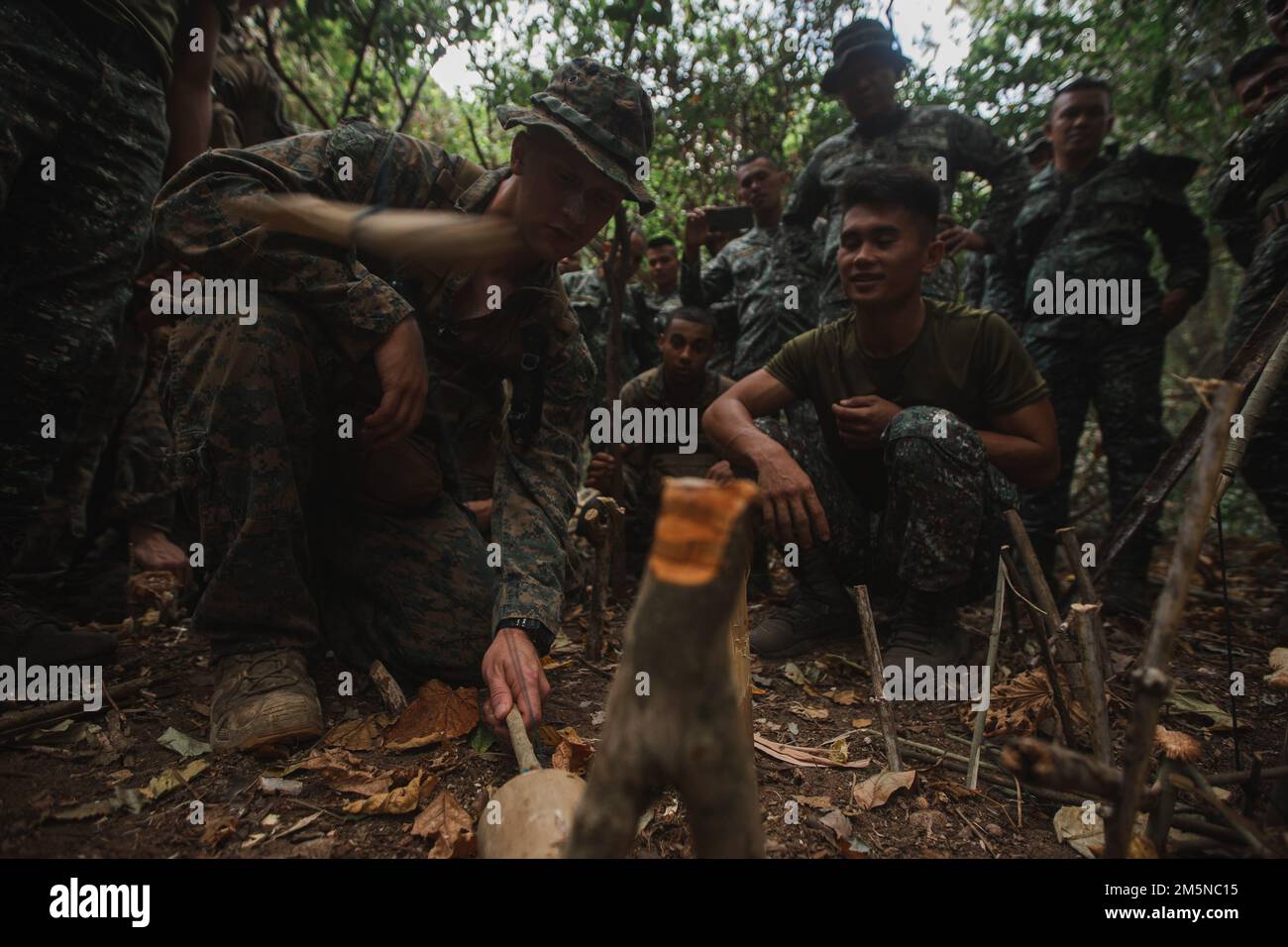 U.S. Marines with 3d Reconnaissance Battalion, 3d Marine Division, and Philippine Marines with Force Reconnaissance Group, conduct jungle survival training during Balikatan 22 at Marine Barracks Gregorio Lim, Cavite, Philippines, March 29, 2022. Balikatan is an annual exercise between the Armed Forces of the Philippines and U.S. military designed to strengthen bilateral interoperability, capabilities, trust, and cooperation built over decades of shared experiences. Balikatan, Tagalog for ‘shoulder-to-shoulder,’ is a long-standing bilateral exercise between the Philippines and the United States Stock Photo