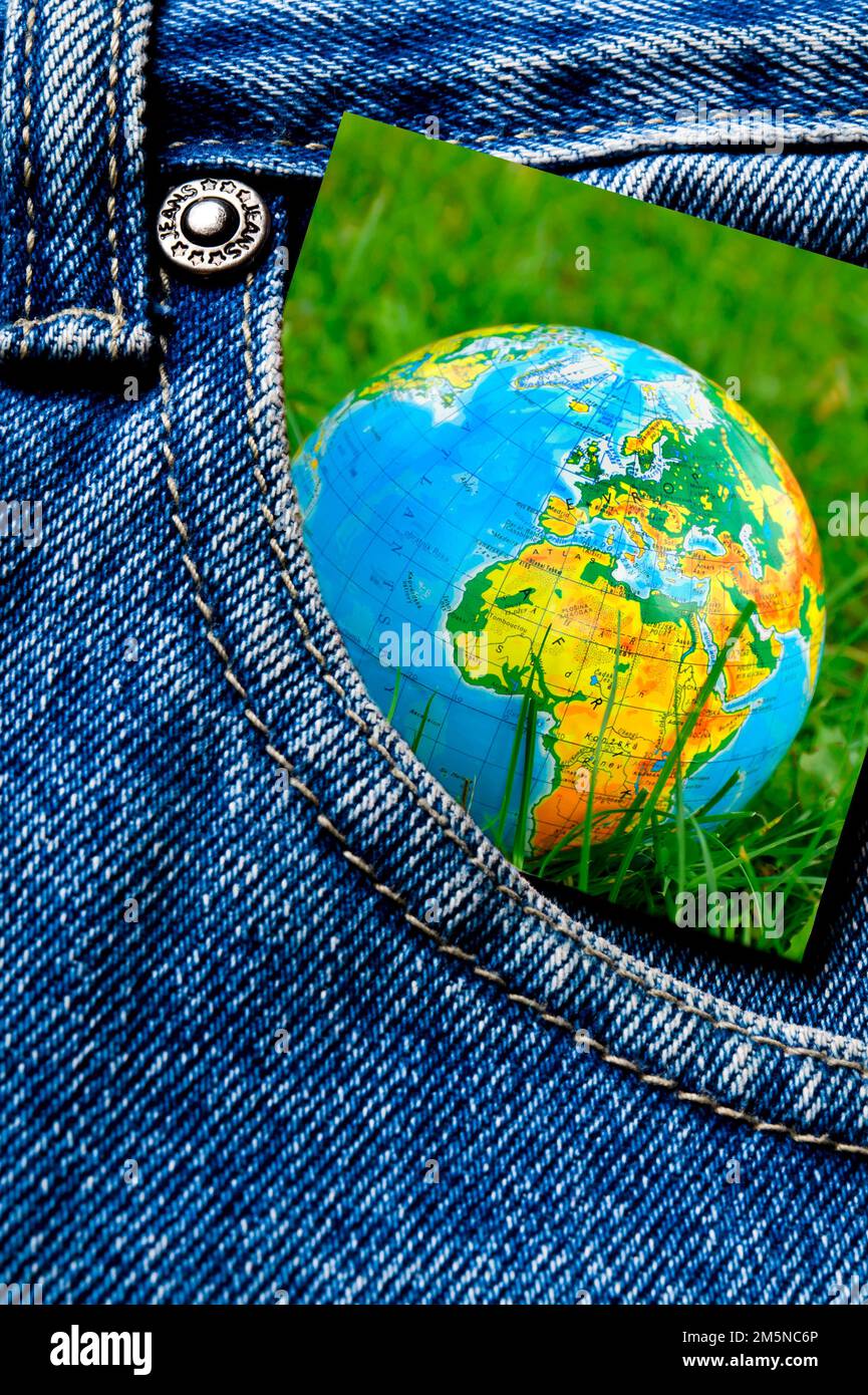 earth card inside a blue jeans pocket Stock Photo