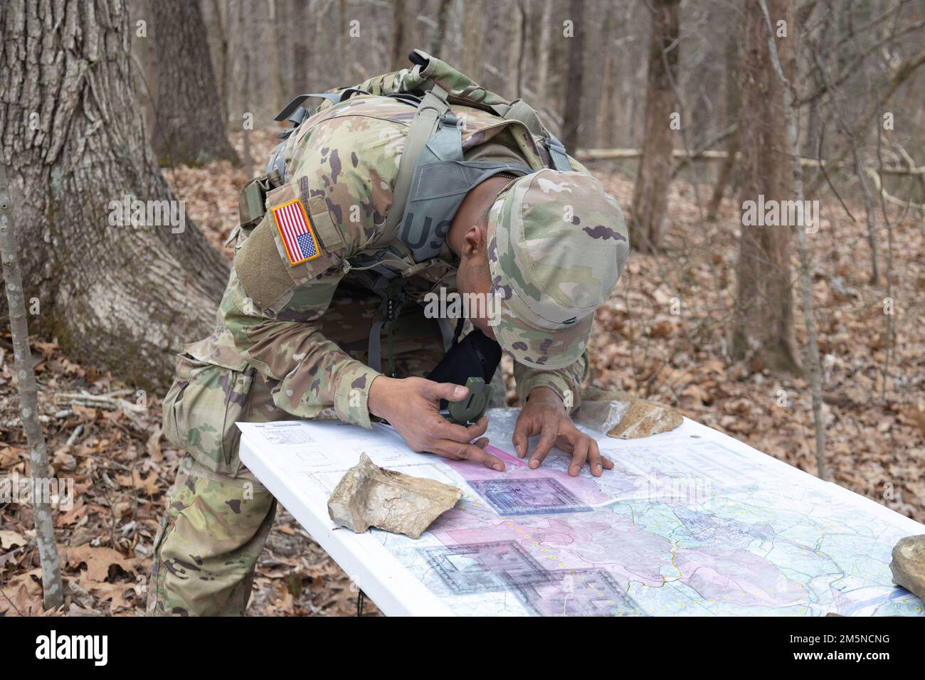 Pfc. Deandre Jones, human resource specialist, 1st Theater Sustainment Command, performs resection on a map during the Best Warrior Competition at Fort Knox, Kentucky, March 30, 2022. Jones was one of 35 soldiers competing in the Best Warrior Competition. Stock Photo